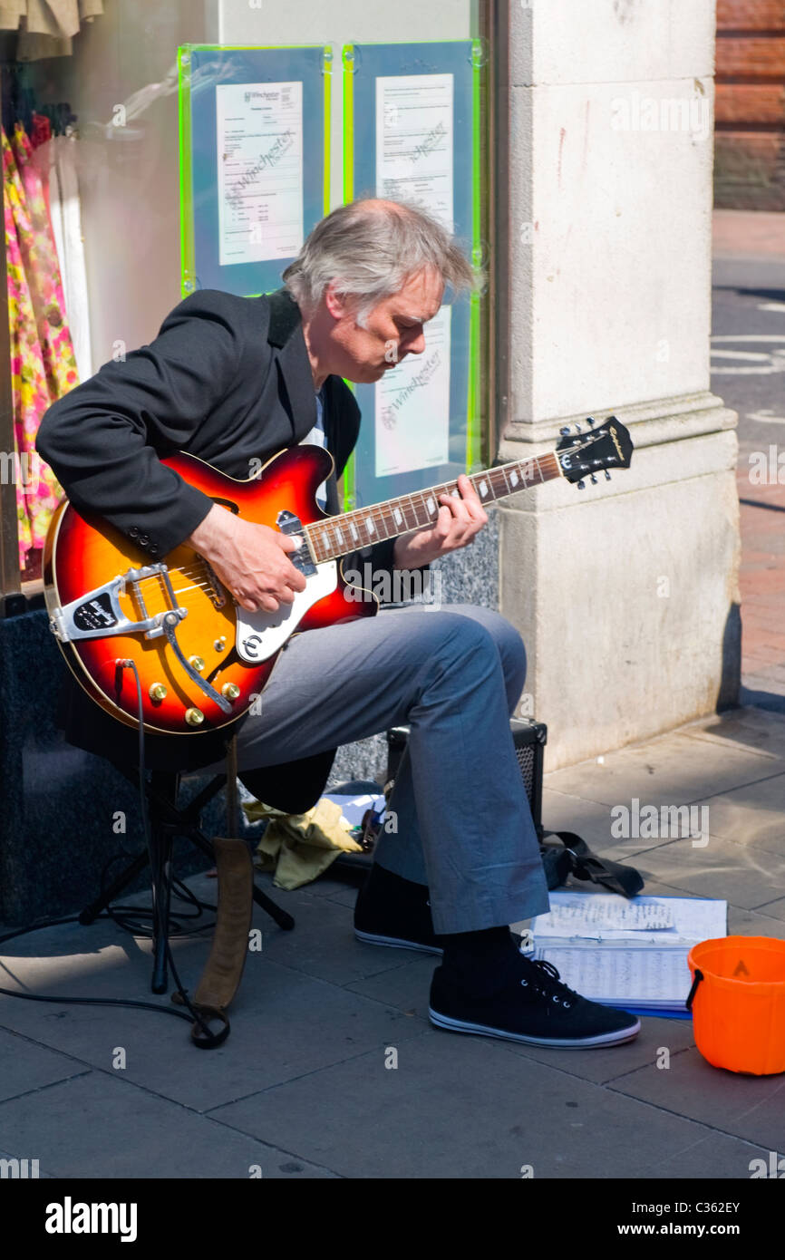 Winchester City , middle aged grey or gray haired balding man playing
