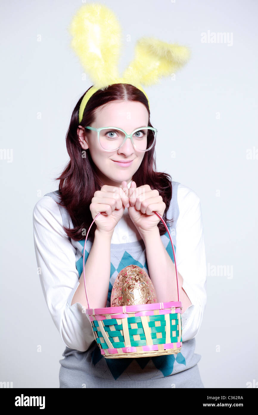 geeky woman with bunny ears and easter basket Stock Photo Alamy