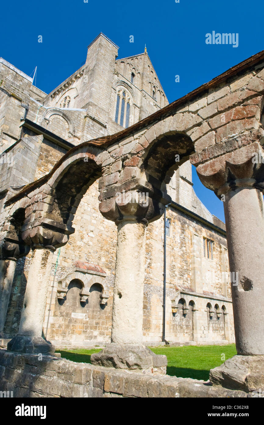 Winchester City Cathedral begun 1097 Norman Chapter House ancient ruins arches & pillars of original Chapter House blue sky Spring grass lawn Stock Photo