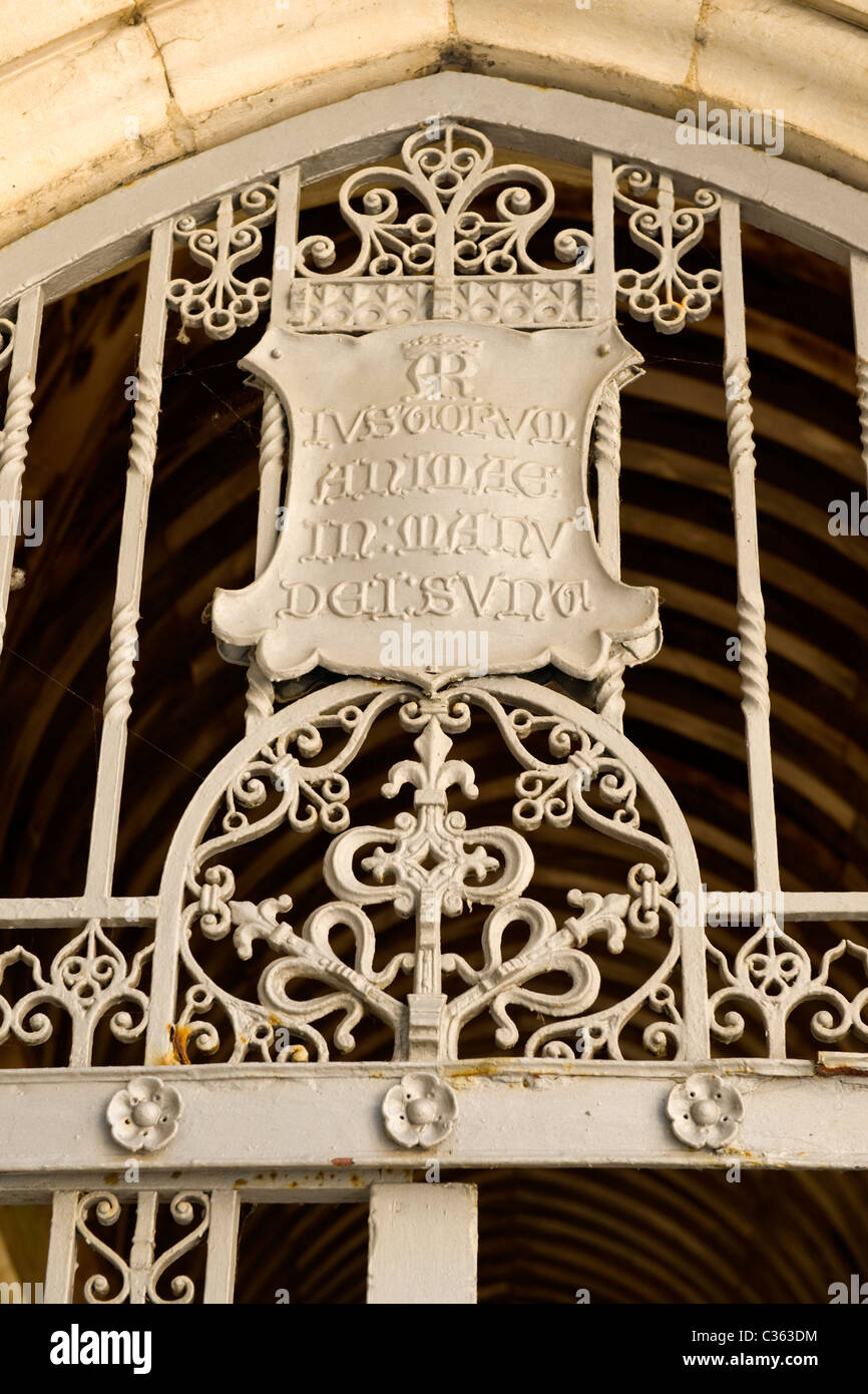 Winchester College founded by charter 1382 by Bishop William of Wykeham detail on gate by chapel latin plaque over gate entrance Stock Photo