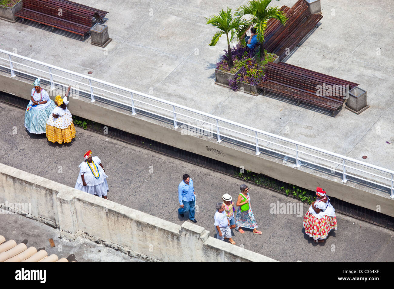 Baiana women and tourists in Salvador, Brazil Stock Photo