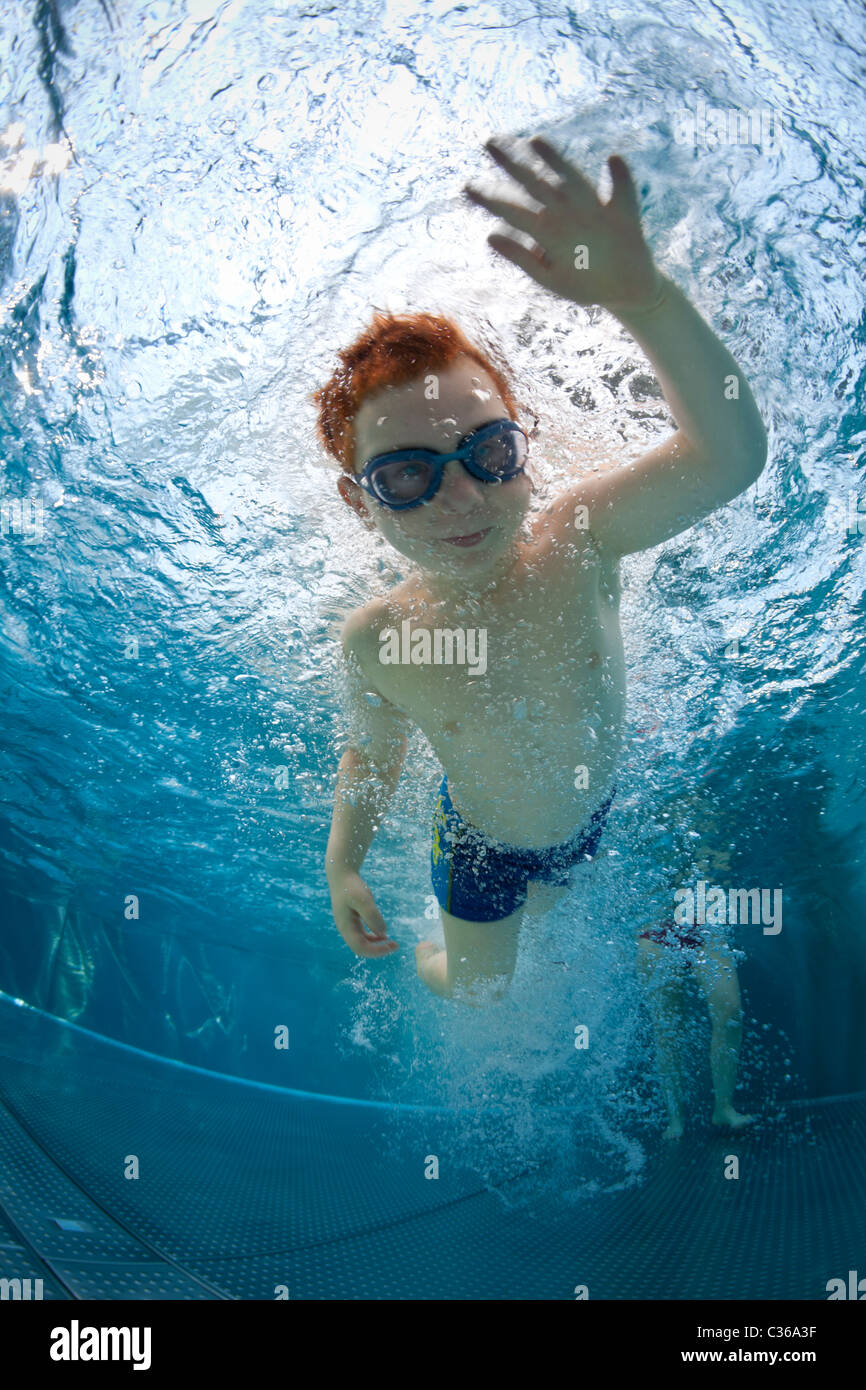 Boy swimming underwater in pool hi-res stock photography and images - Alamy
