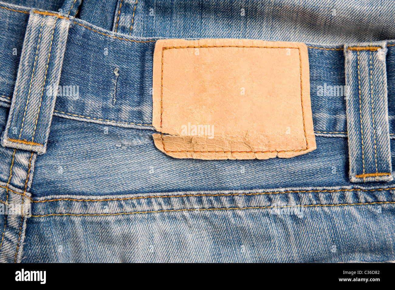 front view of denim label, blue jeans and leather label Stock Photo - Alamy