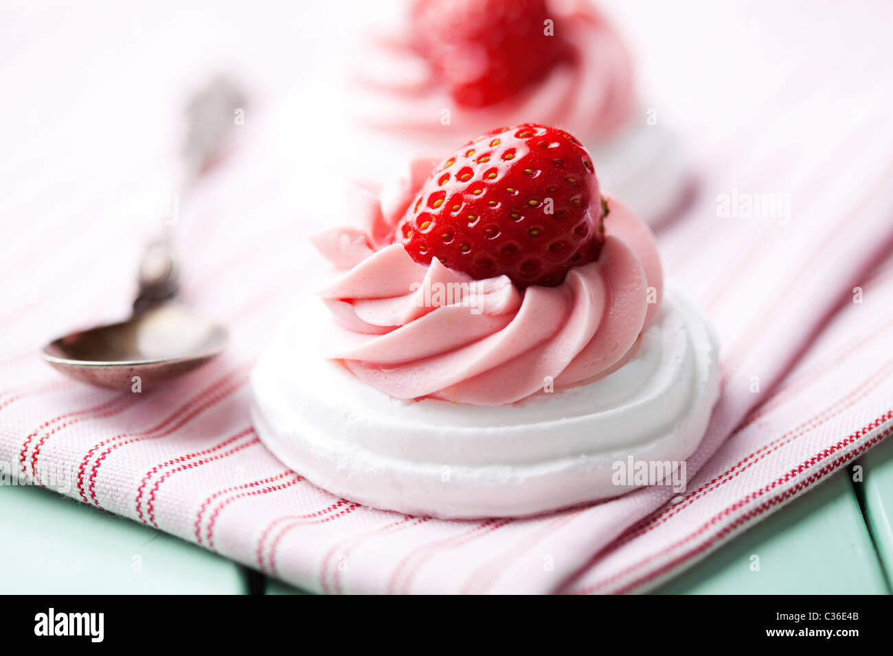 meringue nests with strawberry cream and fresh strawberries Stock Photo