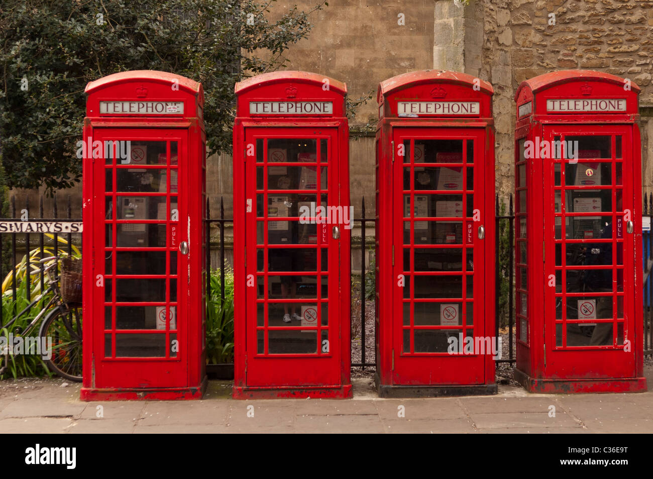 Four old red telephone boxes in Cambridge , Cambridgeshire , England , Britain , Uk Stock Photo