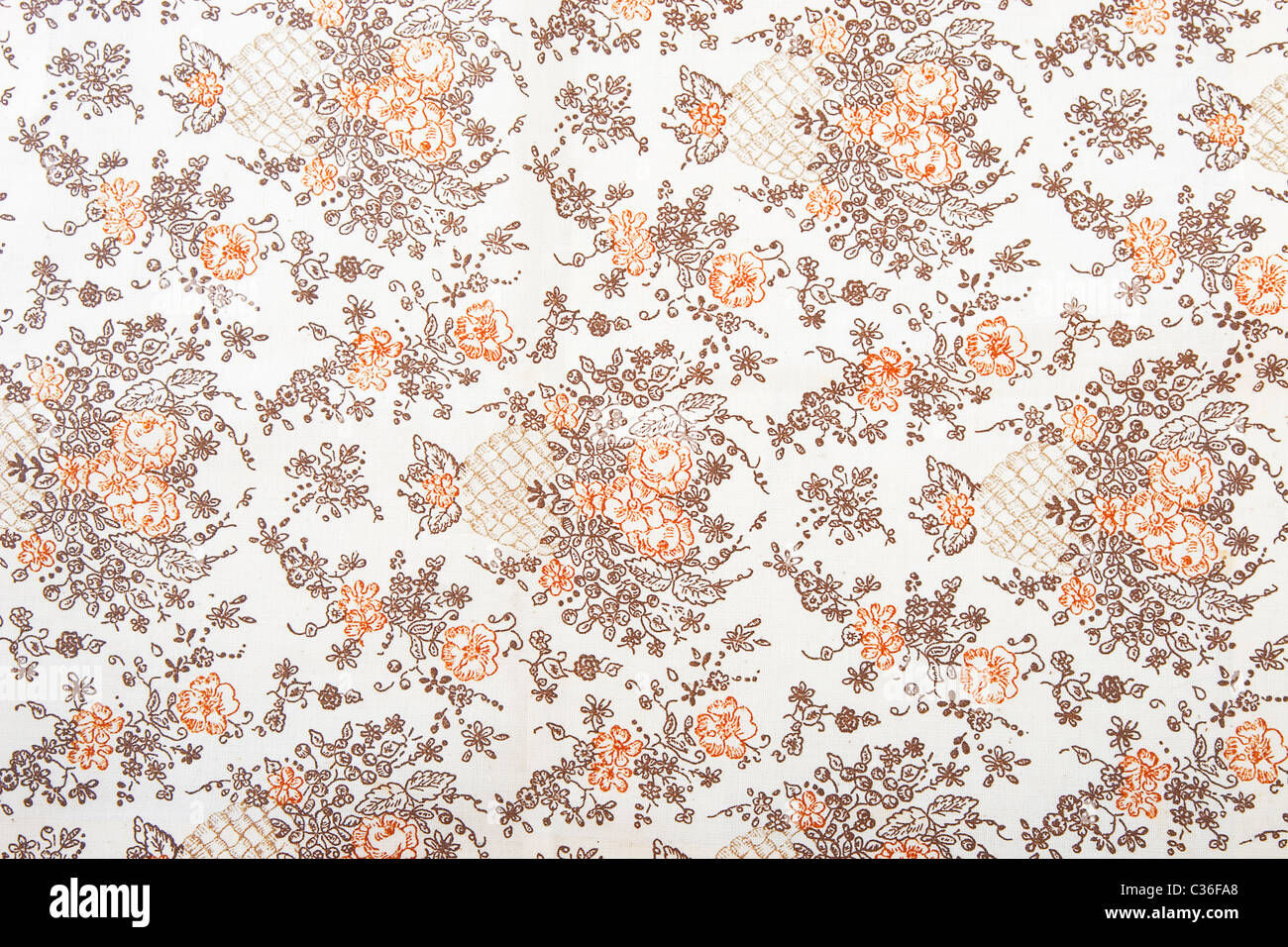 flower fabric texture, orange and brown plants on white background Stock Photo