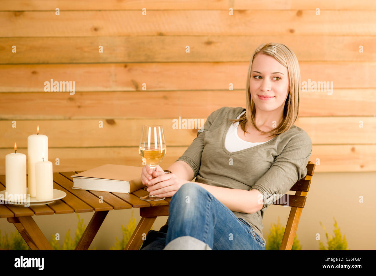 Garden happy woman enjoy glass wine sitting on terrace Stock Photo - Alamy