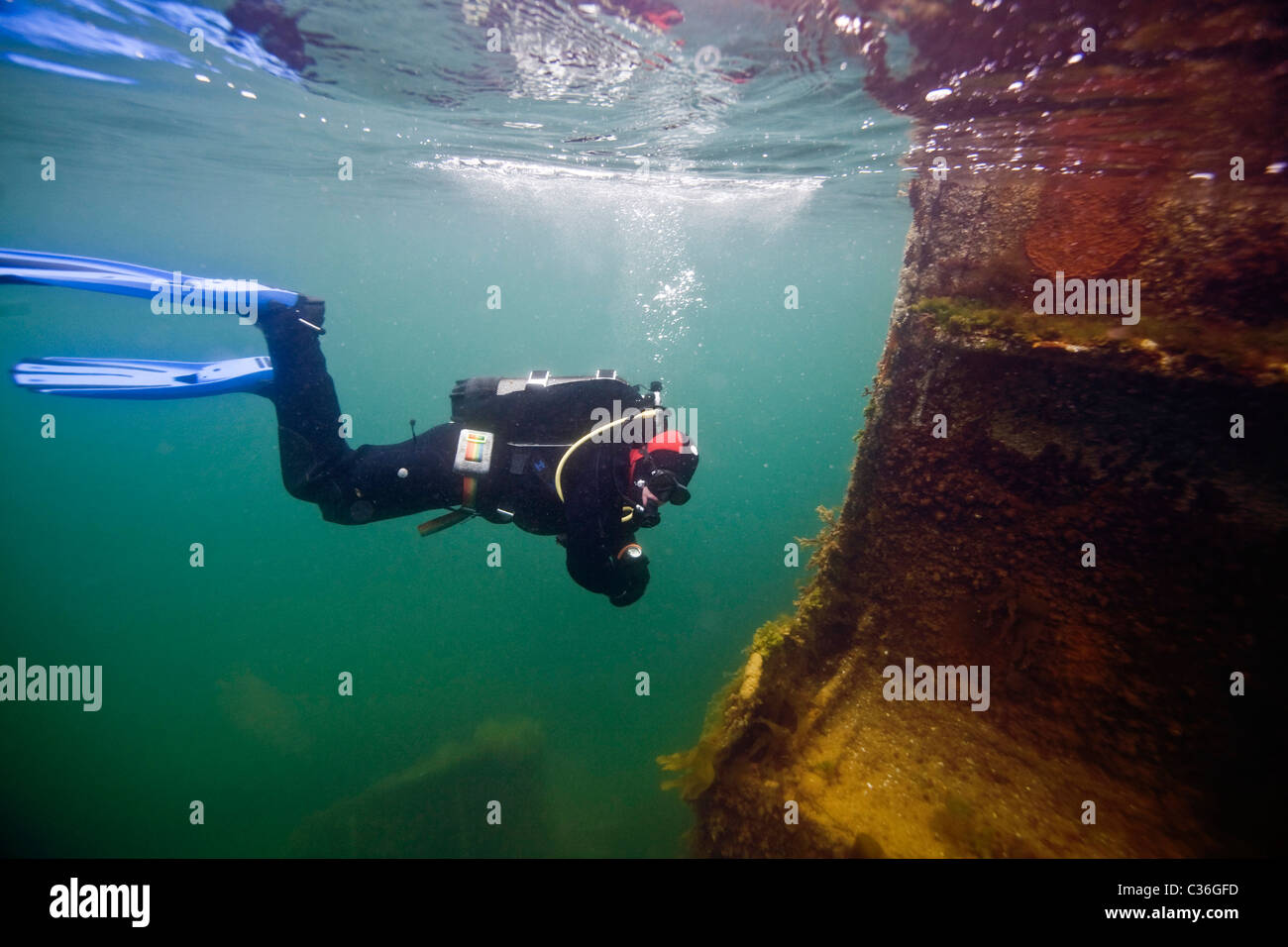 A diver on the wreck of the Empire Seaman, one of the blockships at Churchill Barrier No.3, Scapa Flow, Orkney Stock Photo