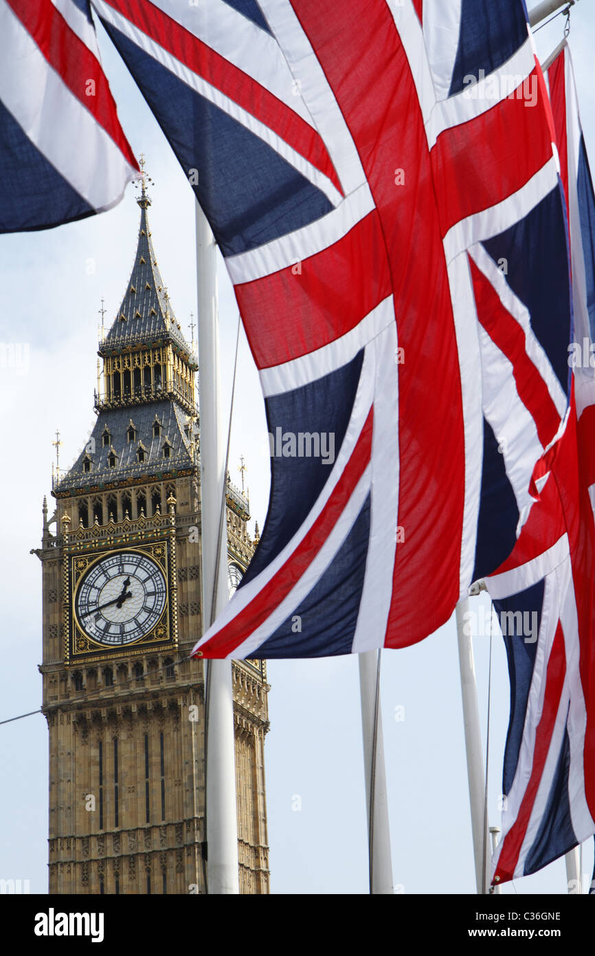 Union Flags flying in front of Big Ben, London, UK Stock Photo