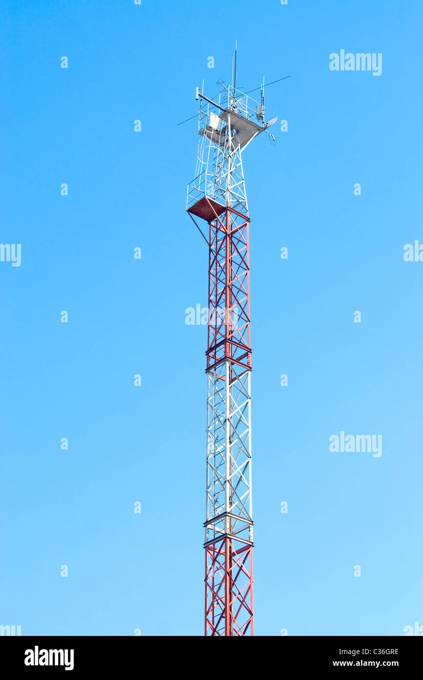 Cellular communication antenna and blue sky background Stock Photo