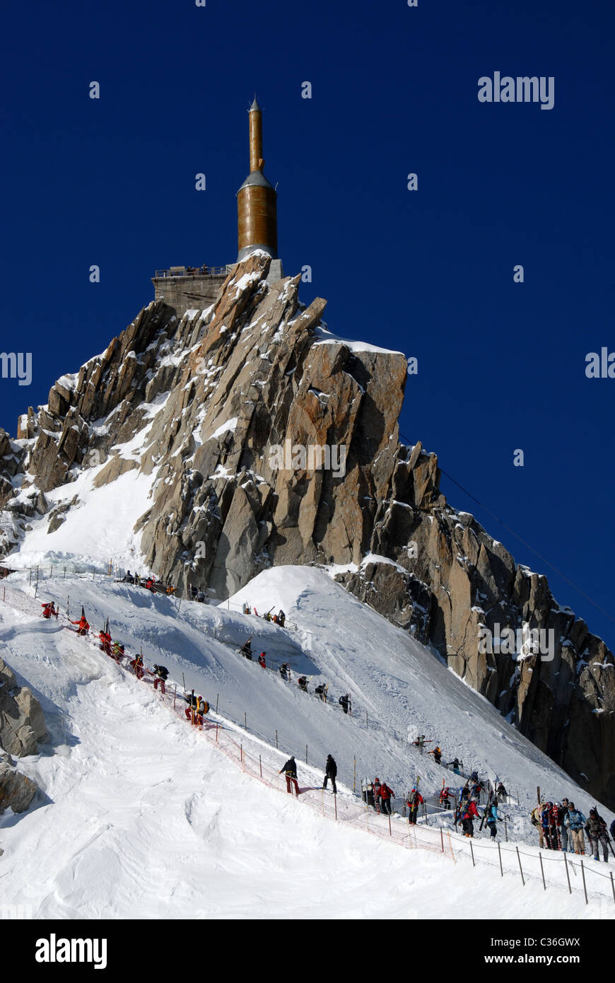 Skiers for tghe Vallée Blanche climb dowbn from Summit of Aiguille du Midi, France Stock Photo