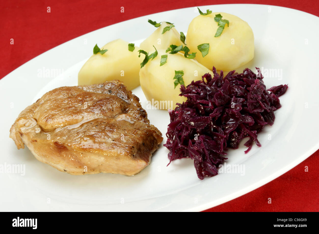Pork roast with potatoes and red cabbage Stock Photo