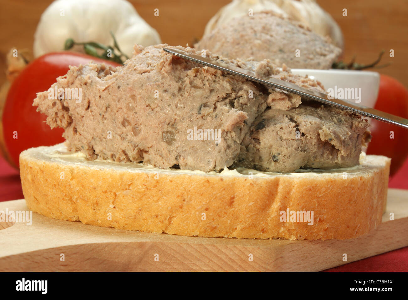 Liver sausage with marjoram on a slice of bread Stock Photo Alamy