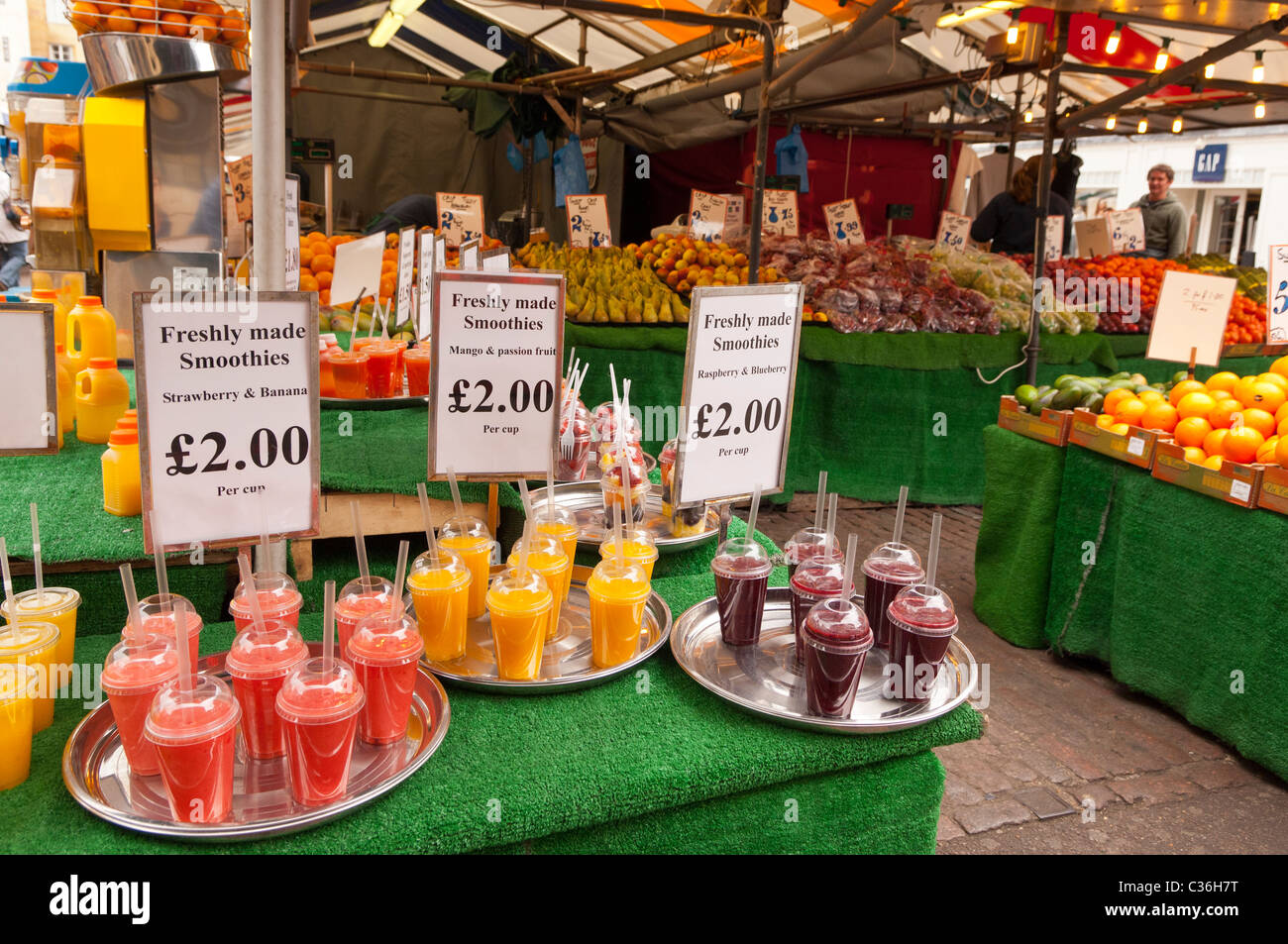 Freshly made smoothies for sale on a market stall in Cambridge
