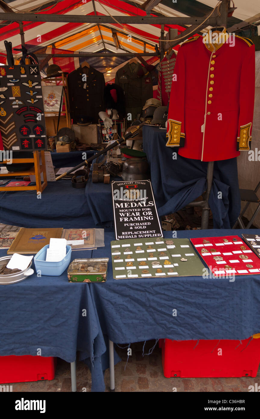 Medals and military items for sale on a market stall in Cambridge , Cambridgeshire , England , Britain , Uk Stock Photo