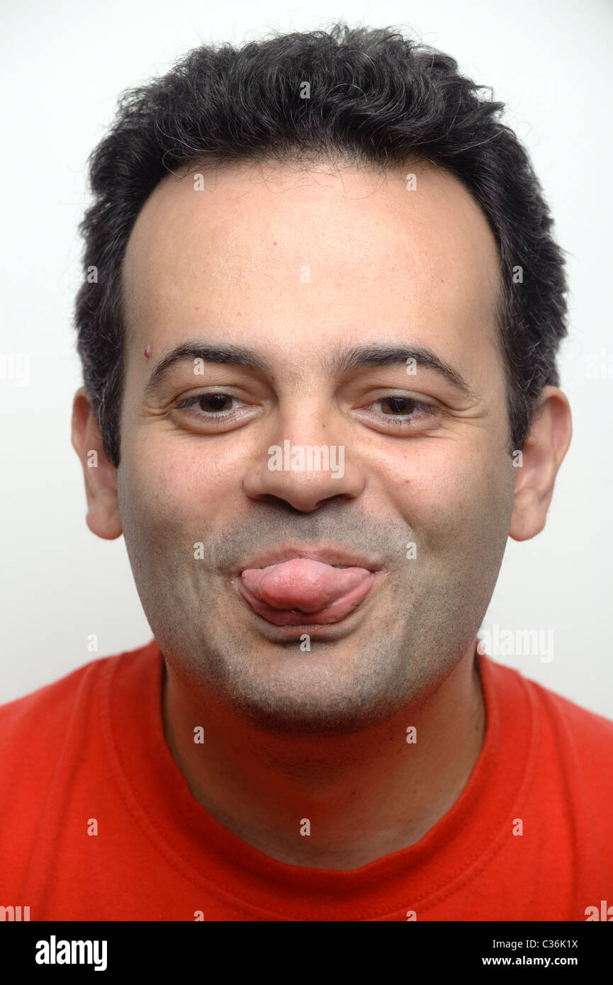 Portrait of a man with his tongue out Stock Photo