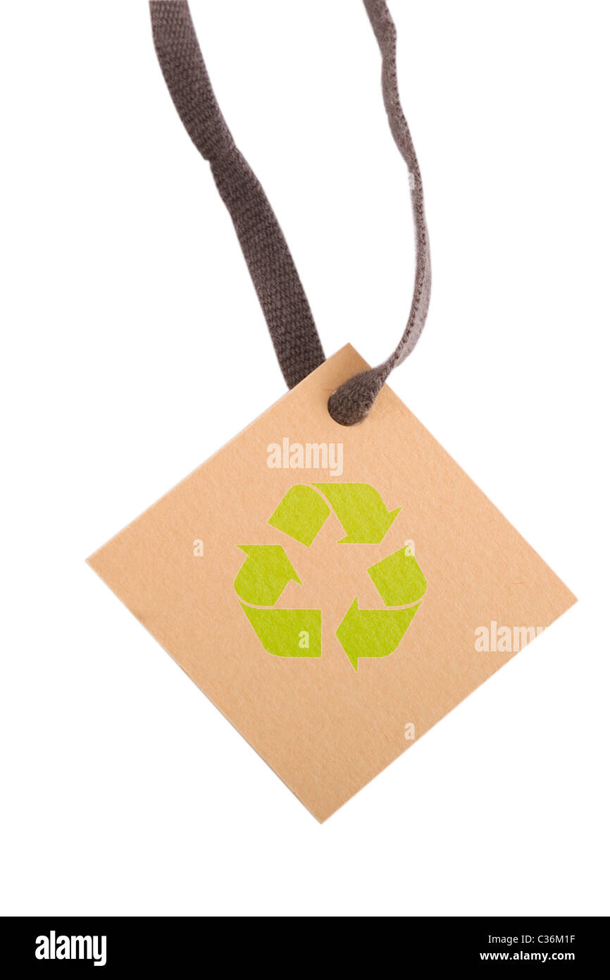 tan tag and green recycling sign on white background Stock Photo