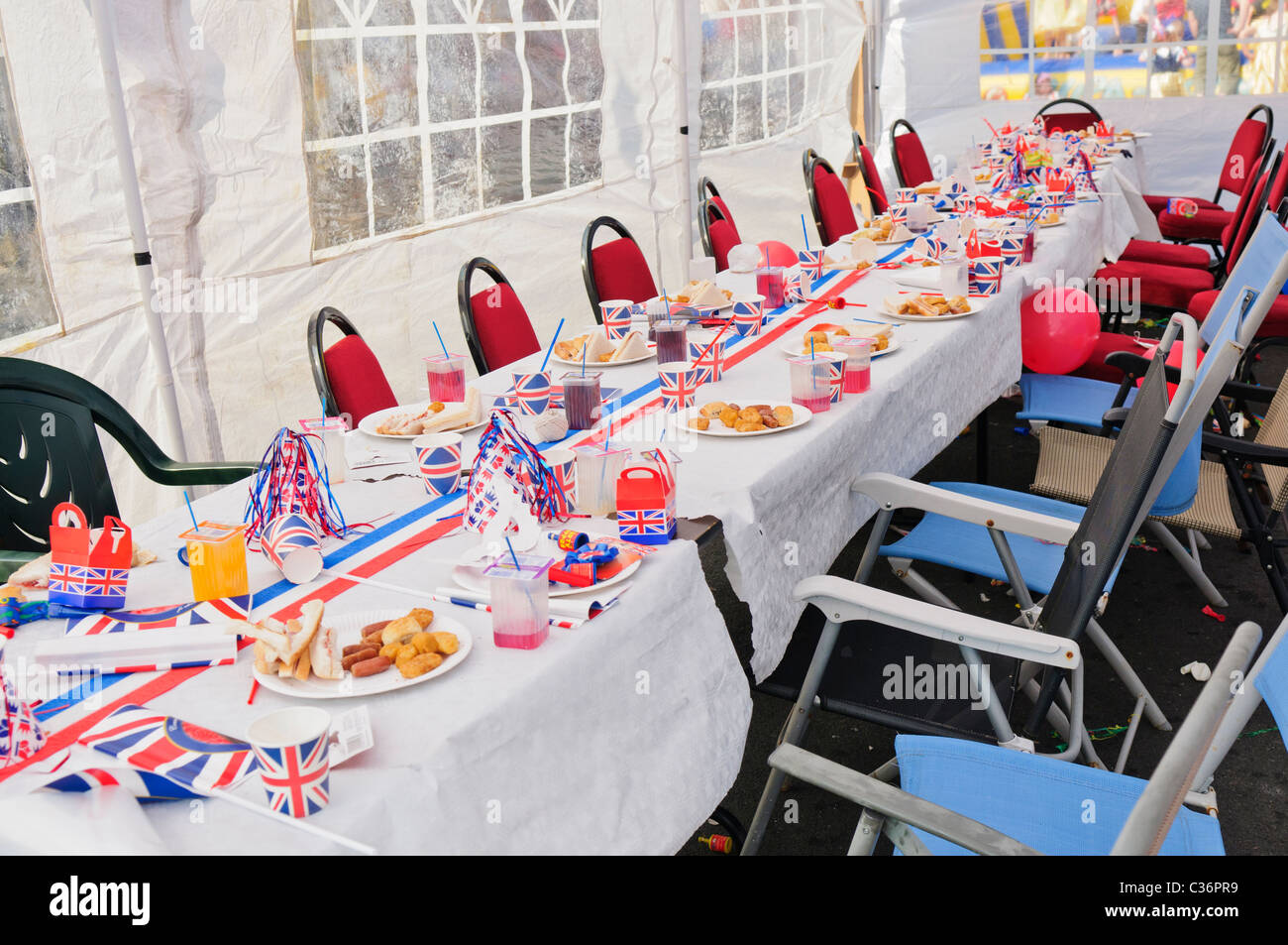 Table is laid out for a traditional British street party to celebrate a Royal Event Stock Photo