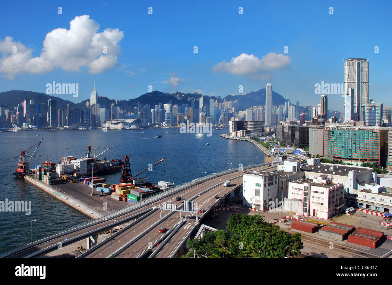 Wide angle view of Hong Kong Island taken from Kowloon with container terminal and expressway in the foreground Stock Photo