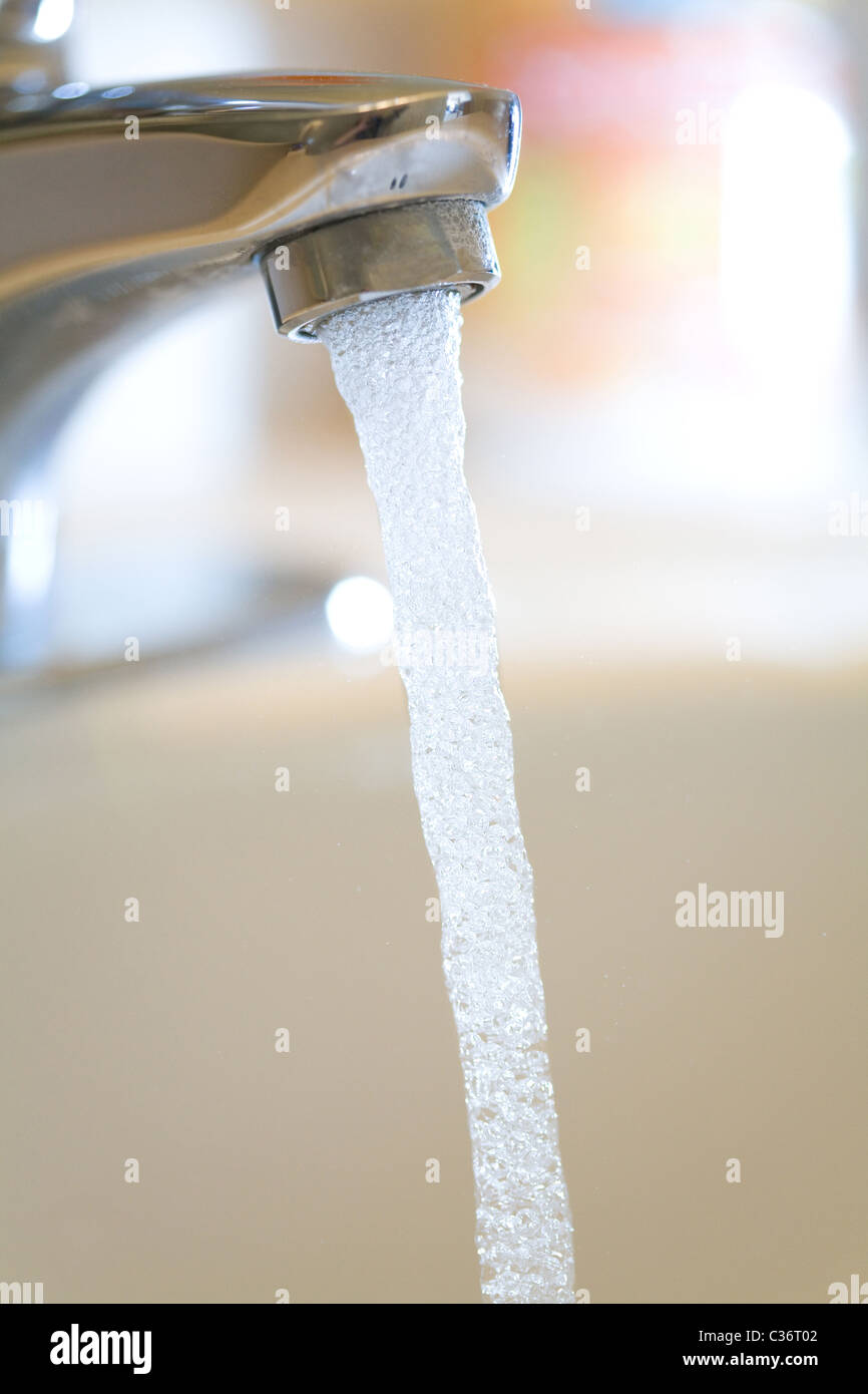 water Faucet /tap and Running Water close up shot Stock Photo - Alamy