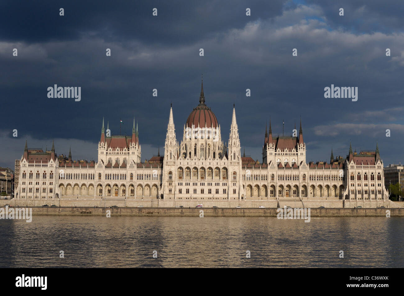 Hungarian Parliament Building with dark clouds and Danube. Stock Photo