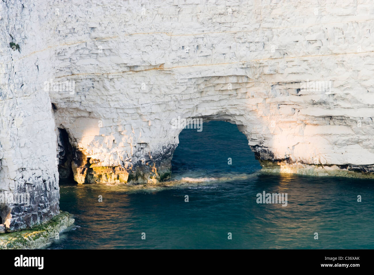 Erosion - natural arch forming at Old Harry Rocks, Dorset, UK Stock Photo