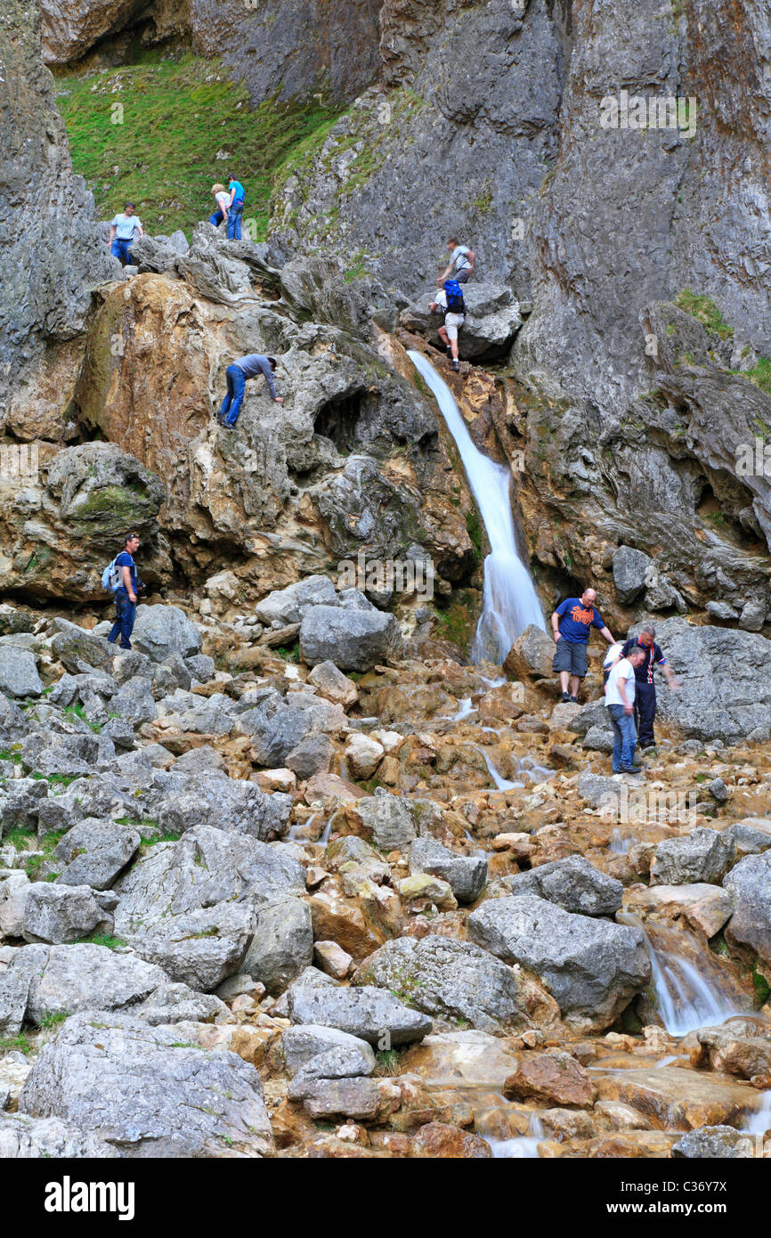 Walkers At Gordale Scar Waterfall Malham Malhamdale North Yorkshire walkers-at-gordale-scar-waterfall-malham-malhamdale-north-yorkshire