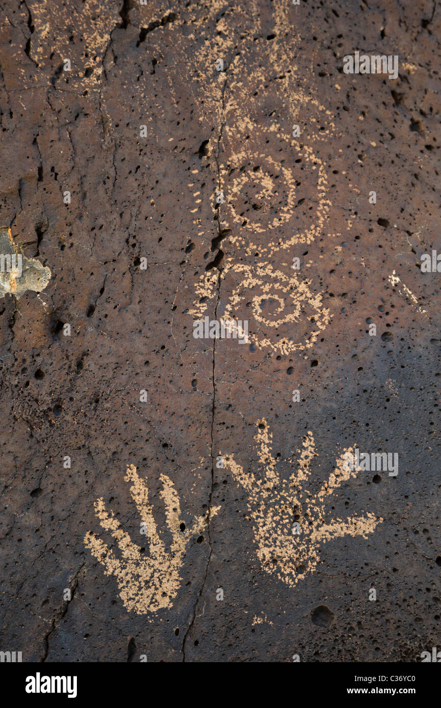 Pair of spiral and hand petroglyphs in Rinconada Canyon at Petroglyph National Monument, Albuquerque, New Mexico, USA. Stock Photo