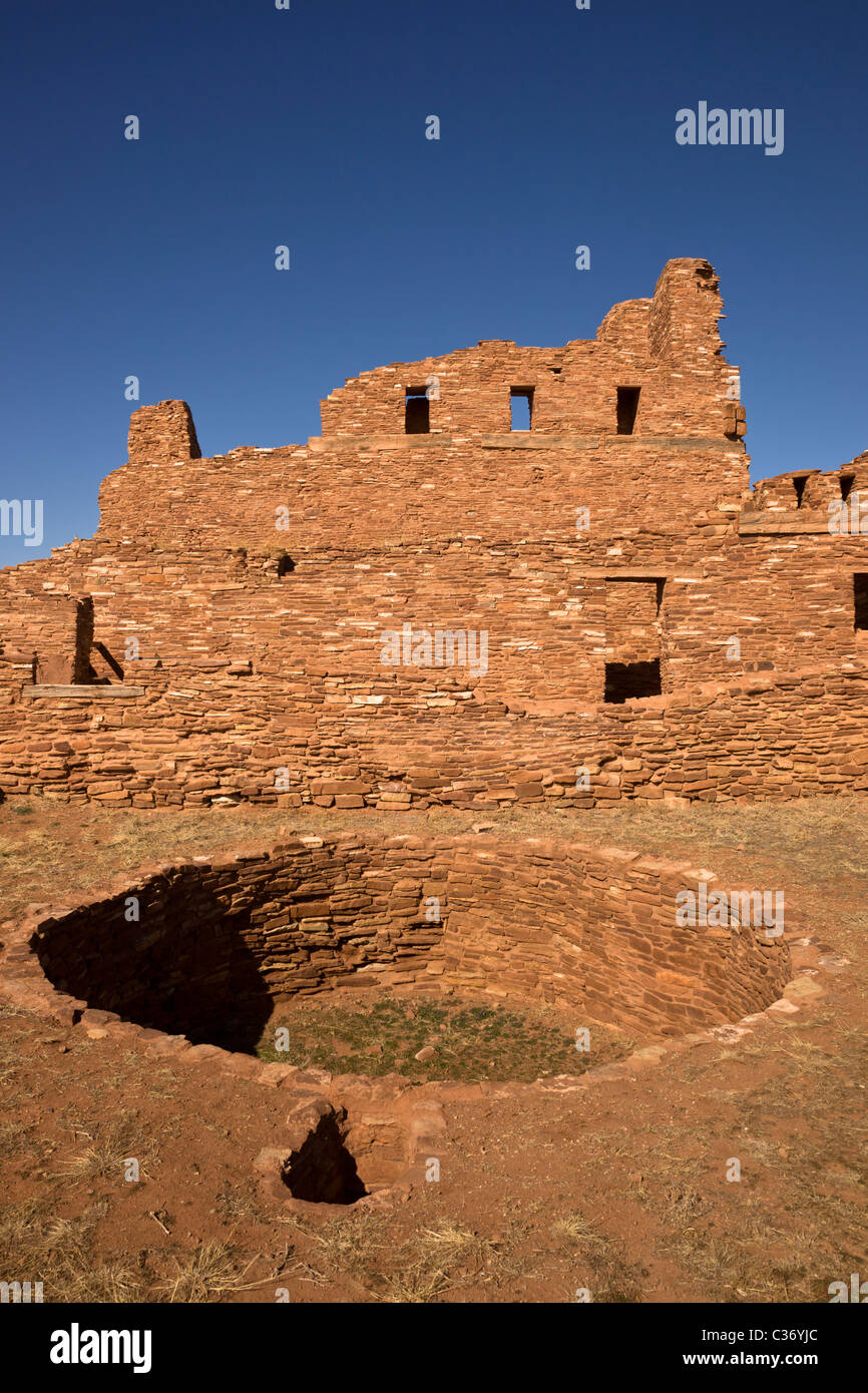 Puebloan Kiva in front of Spanish colonial church at Abo Mission, Salinas Pueblo Missions National Monument, New Mexico, USA. Stock Photo