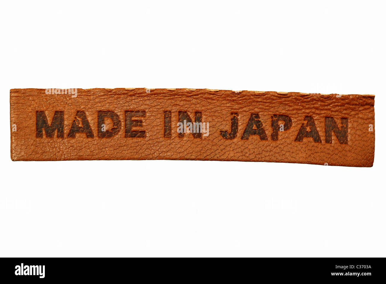 Brown leather label 'MADE IN JAPAN' isolated on white Stock Photo