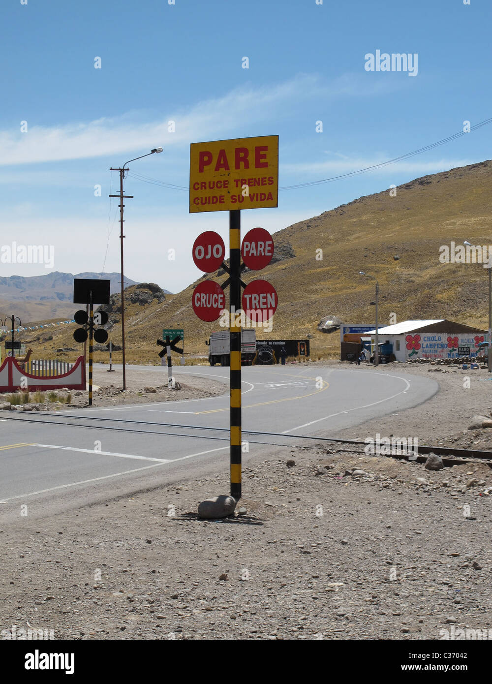 Peruan railway line crossing street Stock Photo