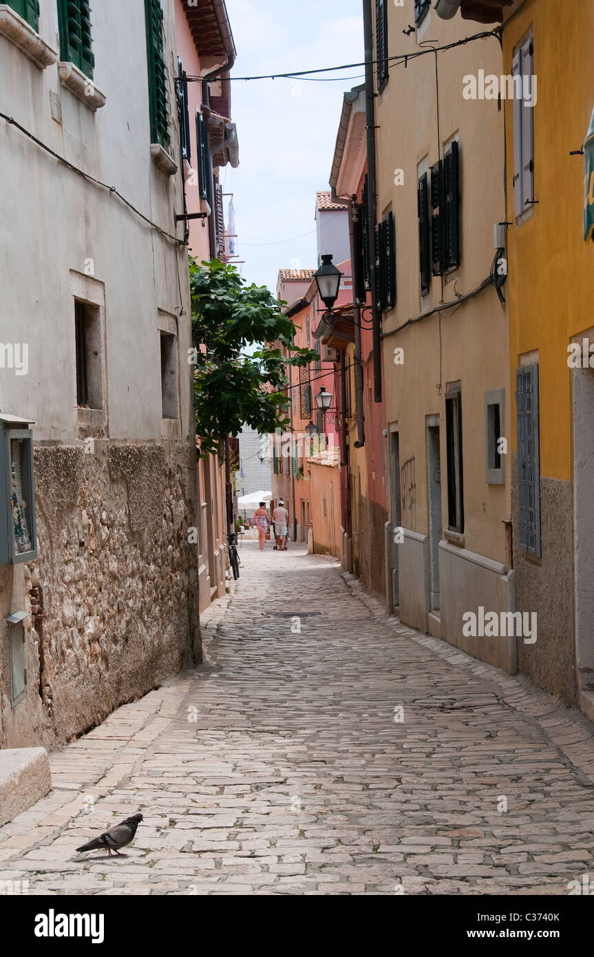 A nice view to a tight alley in the old town of Rovinj. Stock Photo
