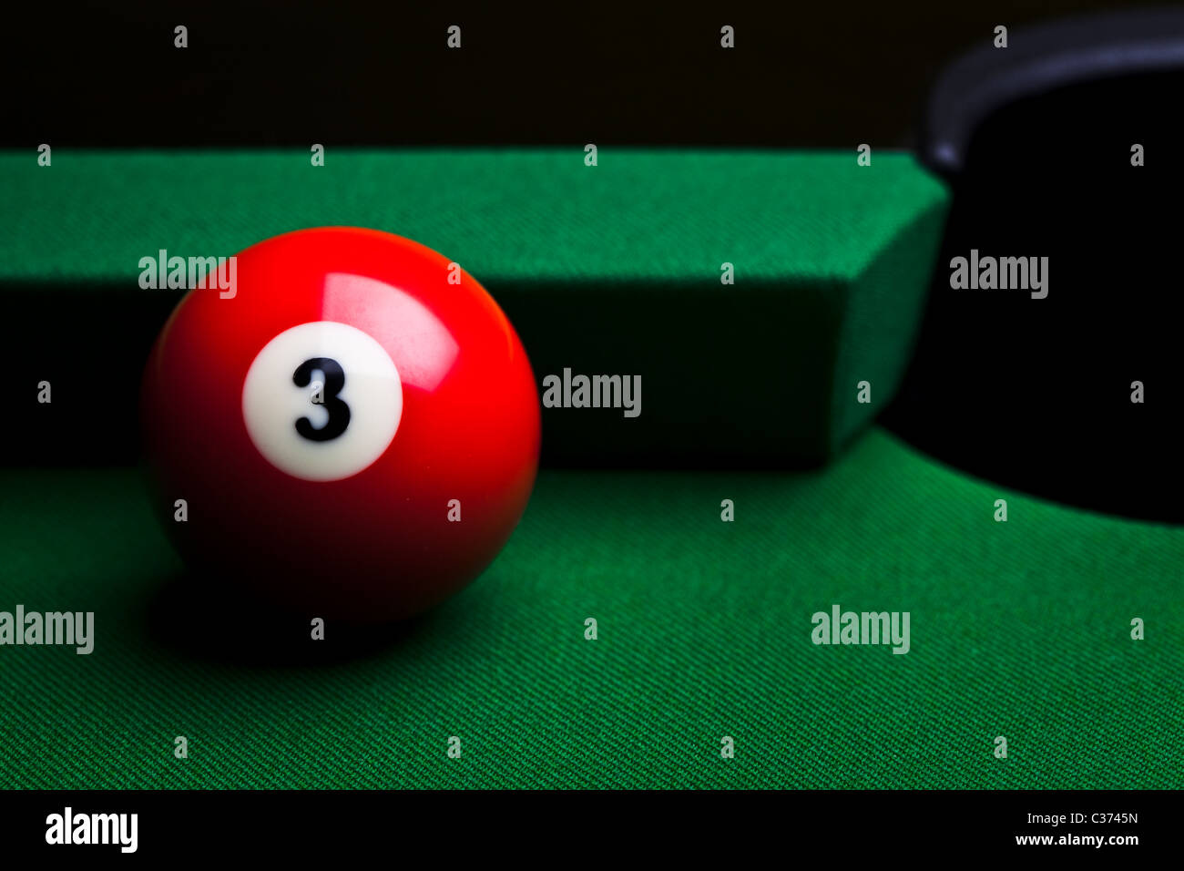 Billiard balls over green table Stock Photo - Alamy