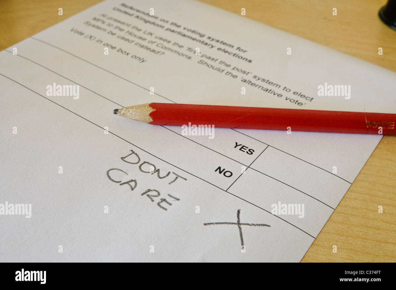 Ballot paper for the Alternative Vote, spoiled by the voter writing 'Don't Care' Stock Photo