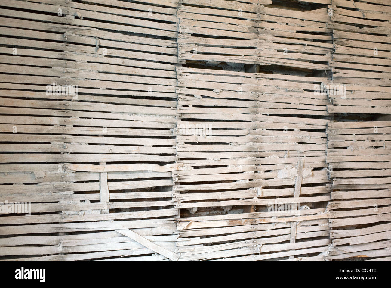 Lath wall with plaster removed Stock Photo