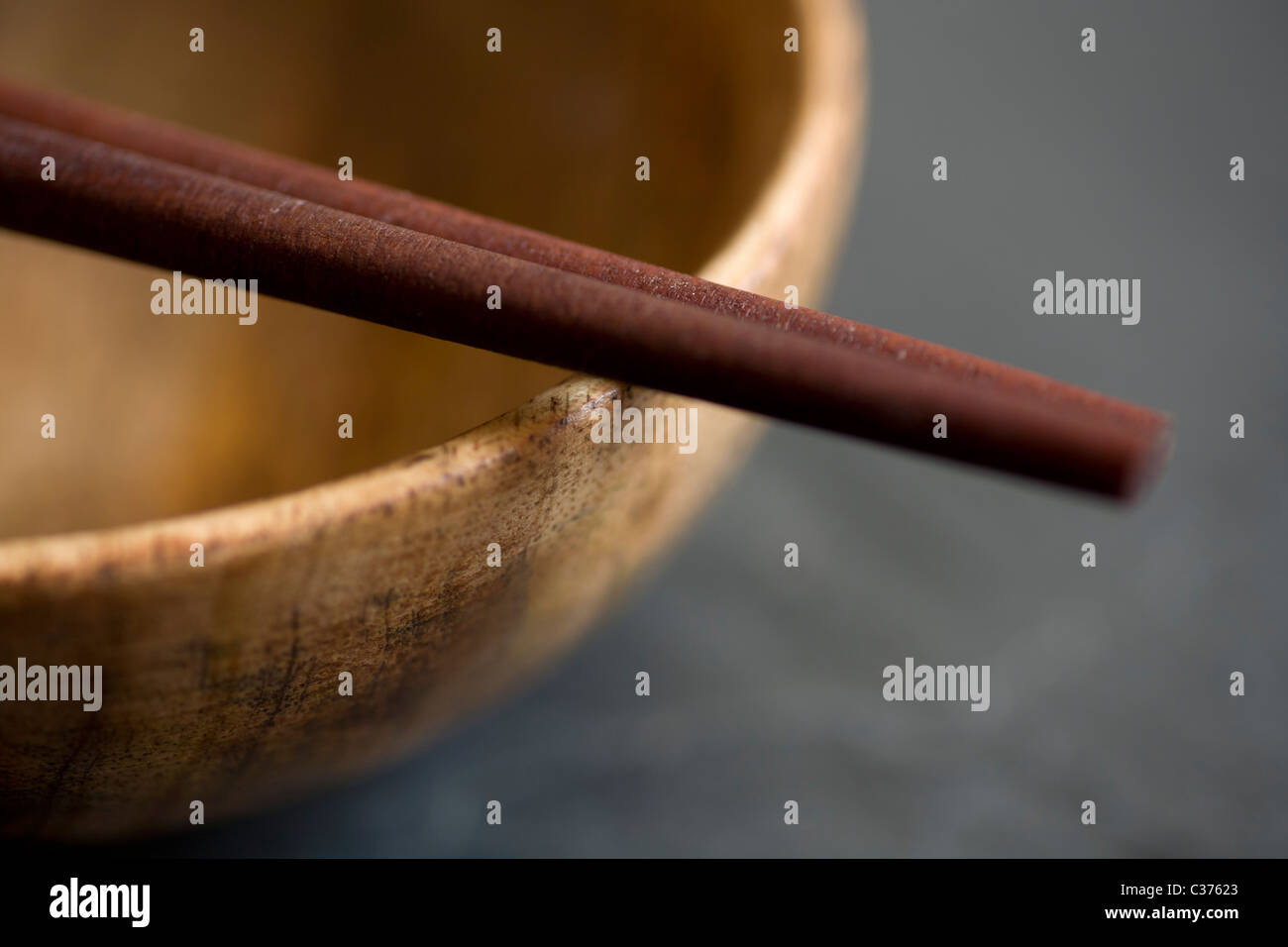 Wooden chopsticks and bowl Stock Photo