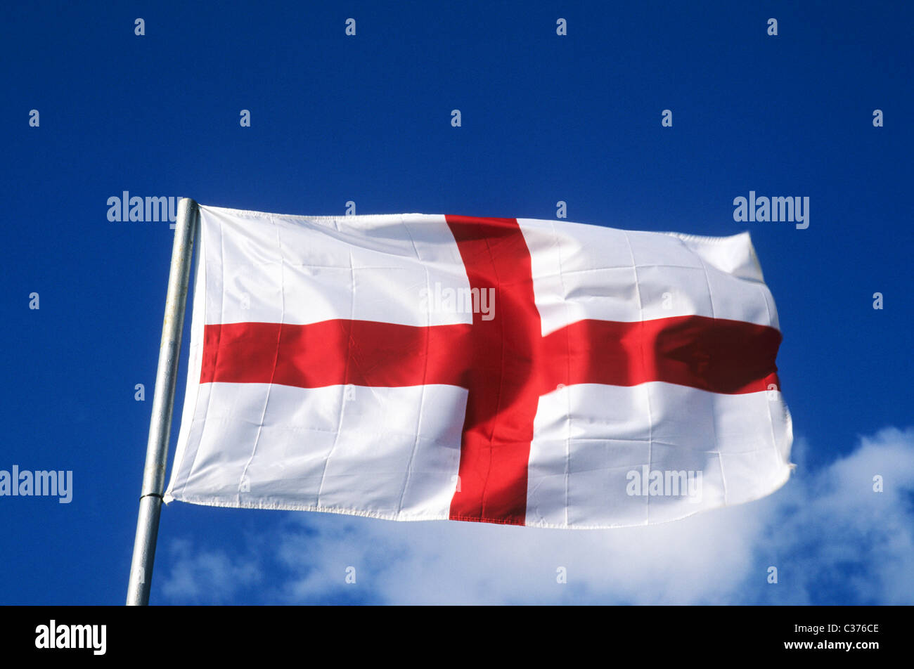 St. George's Flag Saint George national flags England English red cross flagpole flagpoles pole poles flagstaff UK blowing Stock Photo