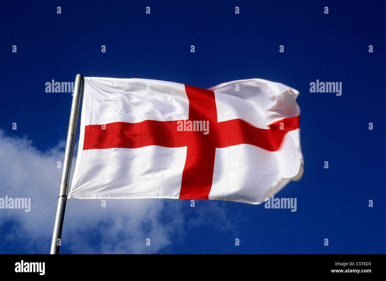 St. George's Flag Saint George national flags England English red cross flagpole flagpoles pole poles flagstaff UK blowing Stock Photo