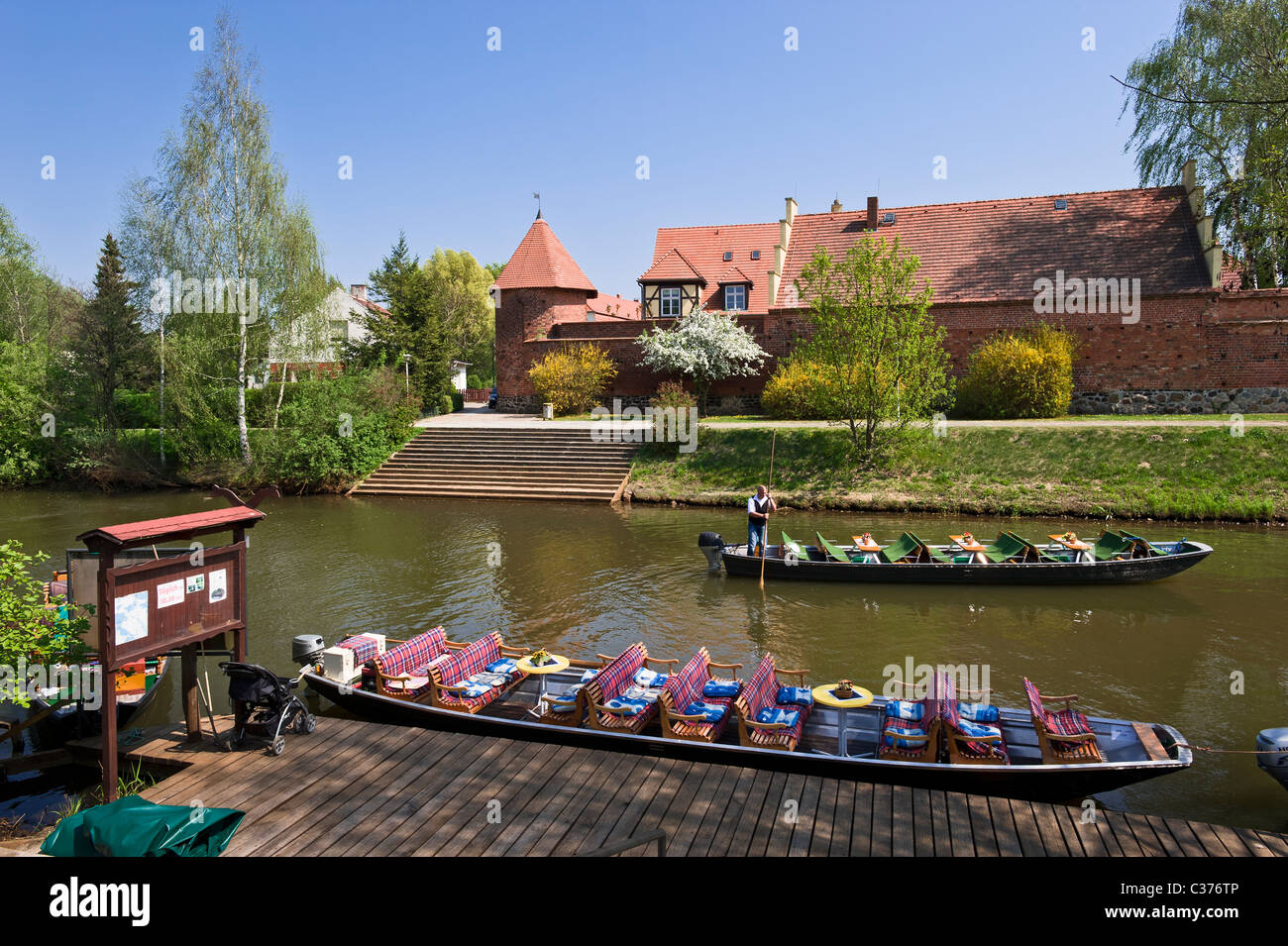 Harbour for barges with historic city walls and Speckturm tower at back, Luebben, Spreewald, Lower Lusatia, Brandenburg, Germany Stock Photo