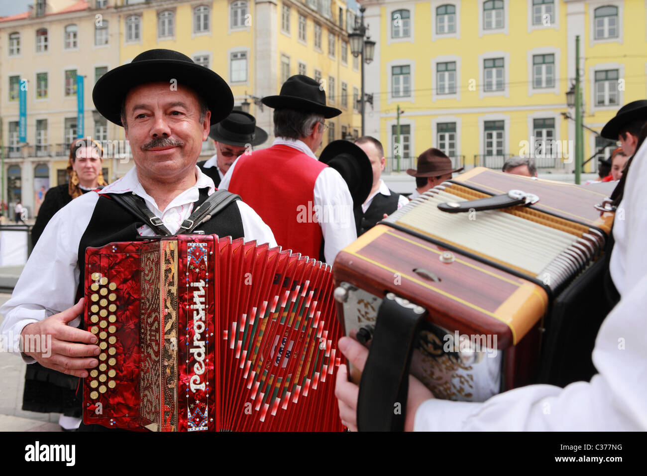 An accordion player from a Portuguese folk group wears the traditional costume of the Minho region. Stock Photo