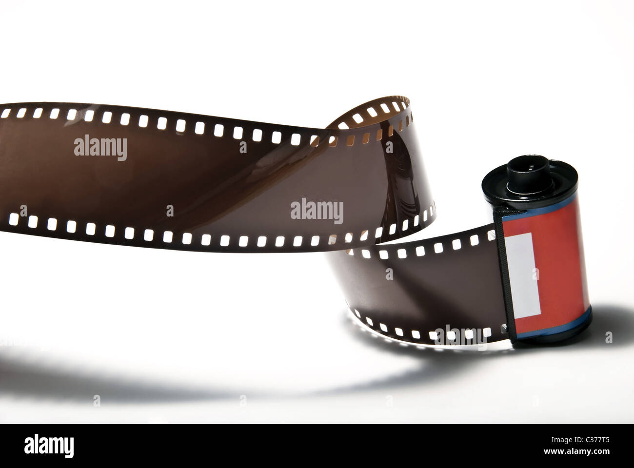 a rolled out analogous photo film on white background Stock Photo - Alamy