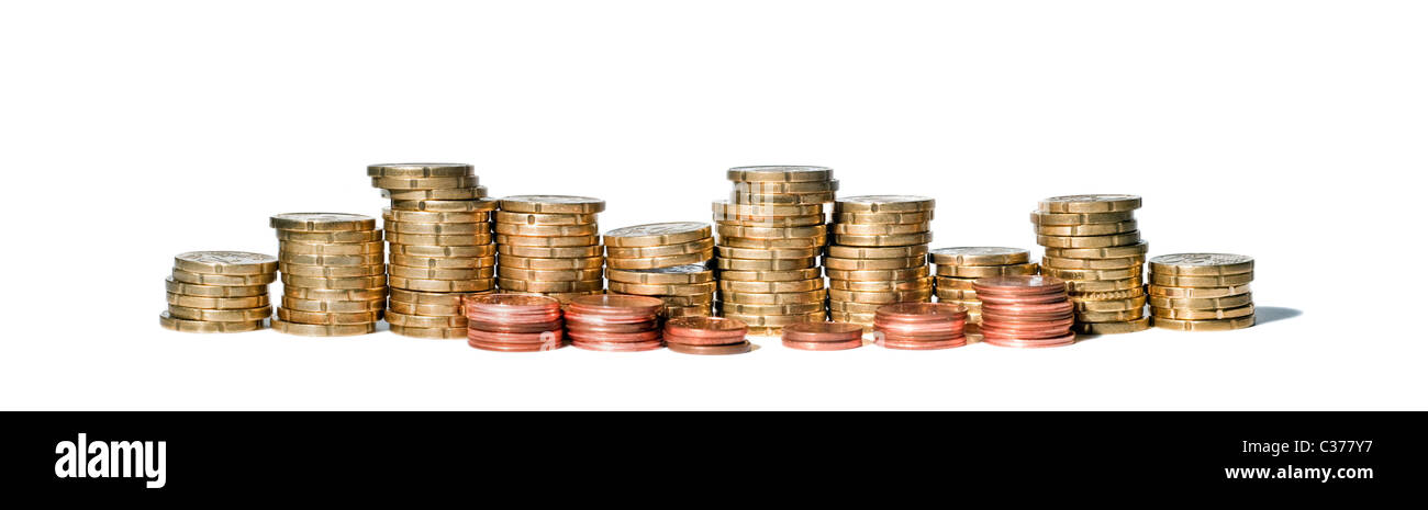 Panorama of coin piles on white background Stock Photo - Alamy