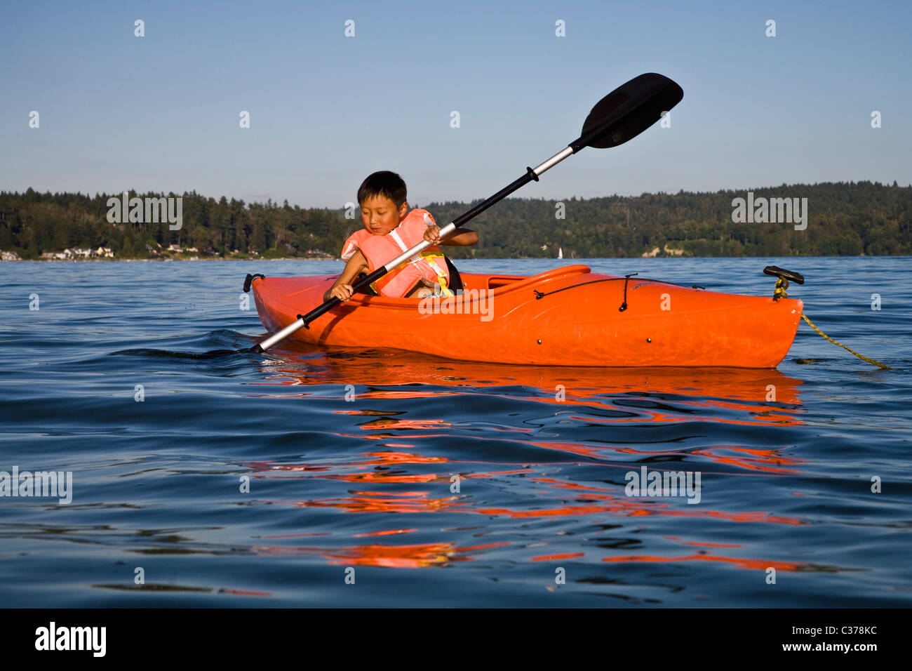 boy kayaking in puget sound Stock Photo