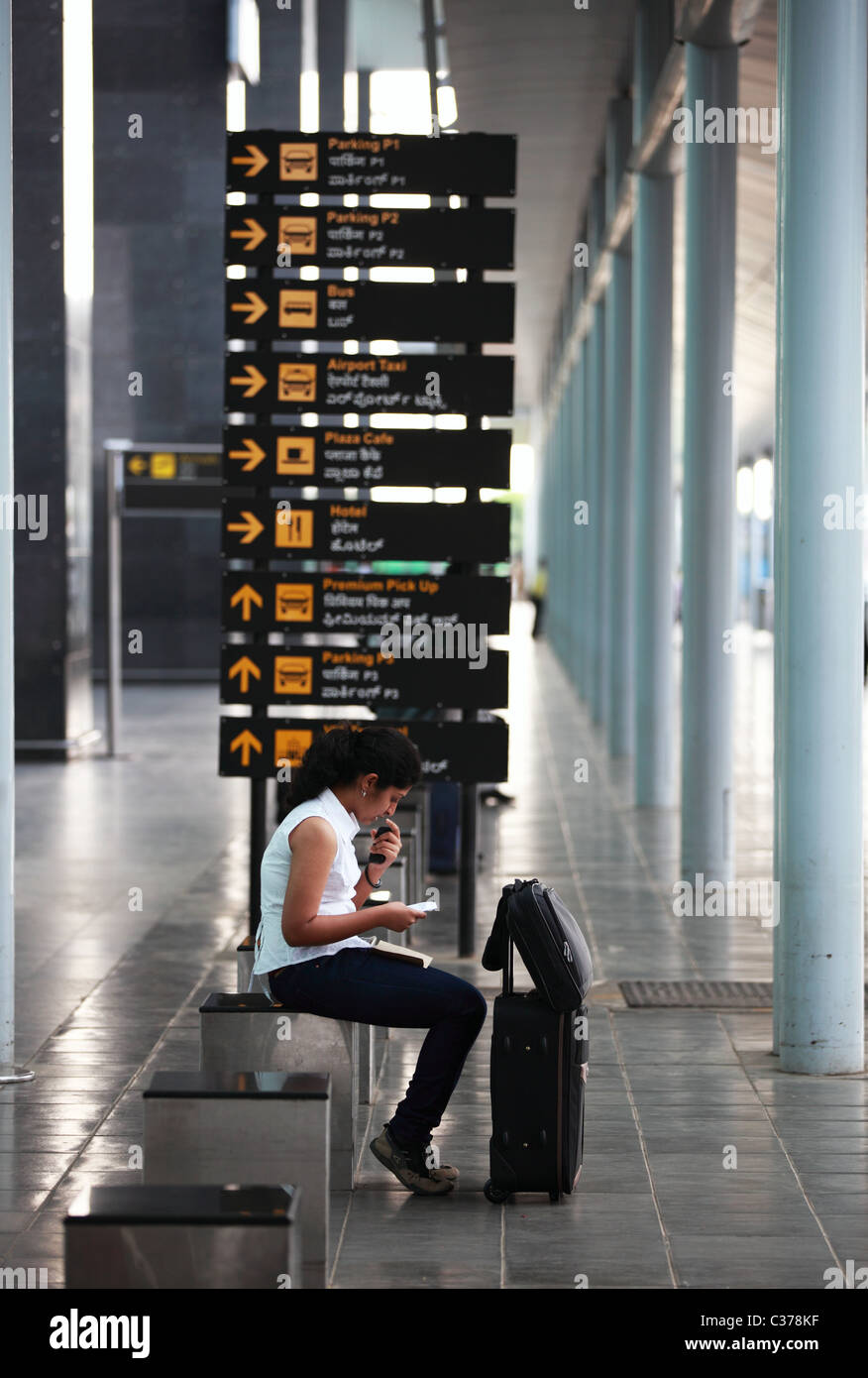 Lady waiting at the airport in Bengaluru South India Asia Stock Photo