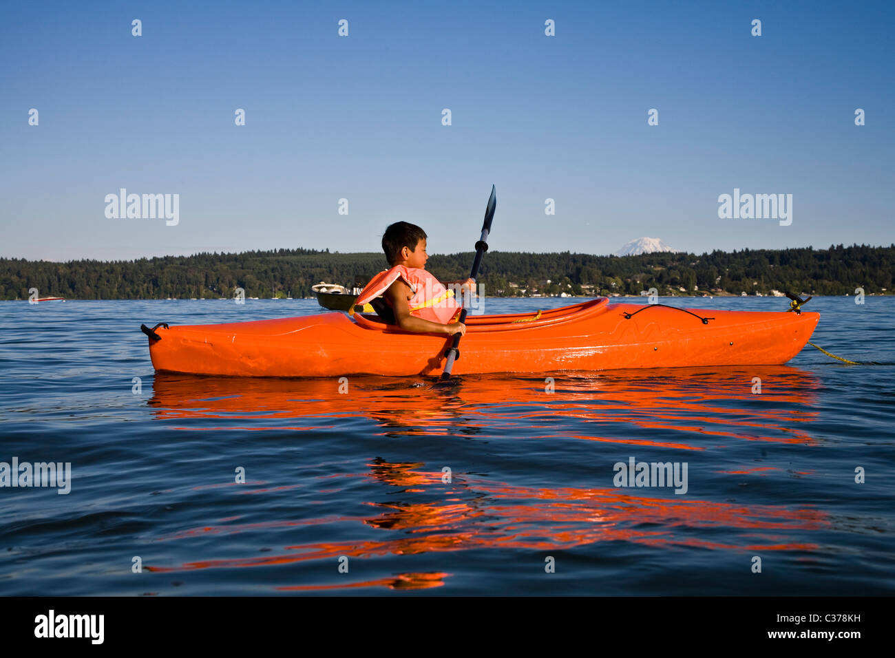 boy kayaking in puget sound Stock Photo