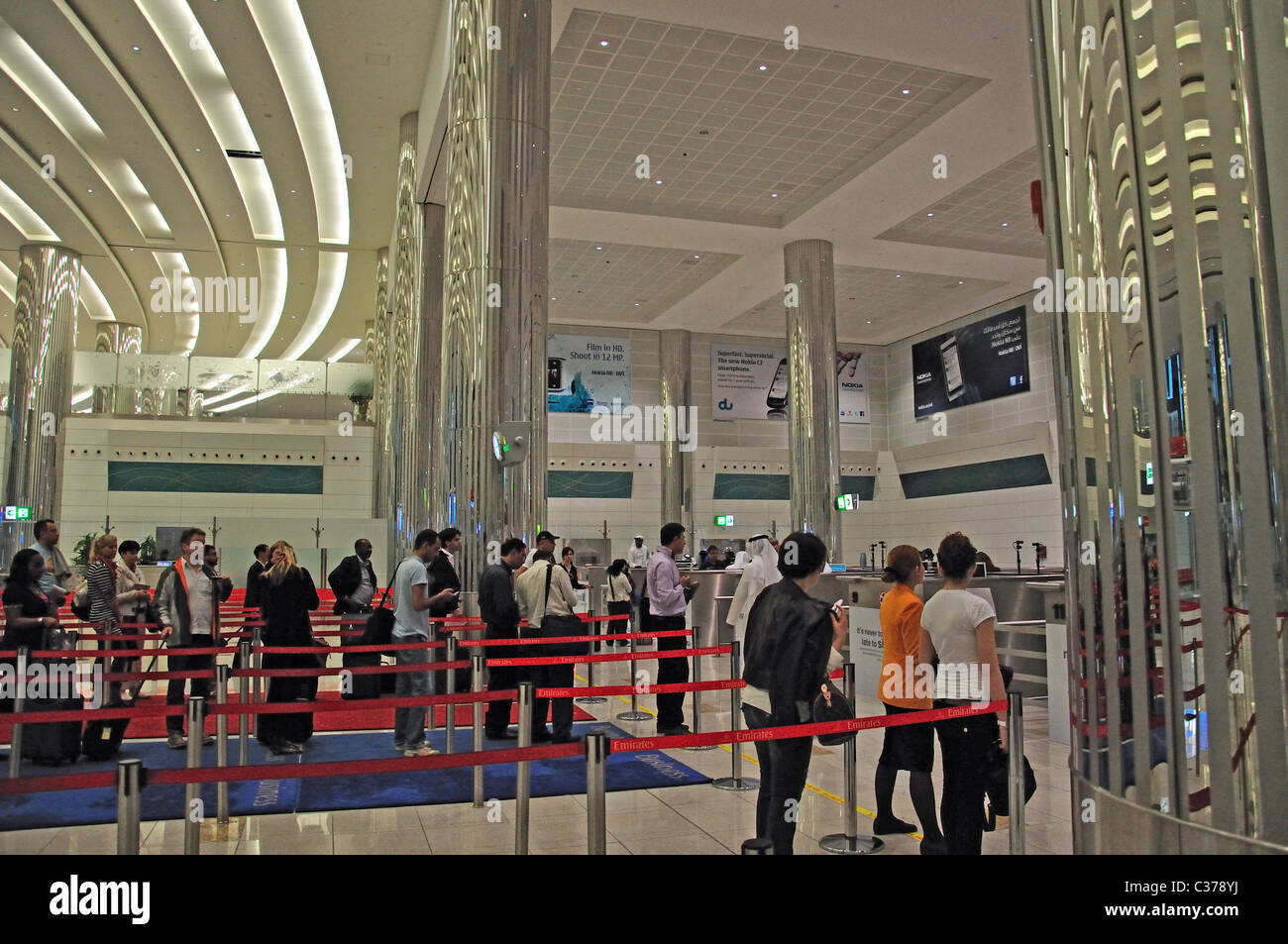 Passport control in arrivals hall, Emirates Terminal 3, Dubai International Airport, Al Garhoud, Dubai, United Arab Emirates Stock Photo