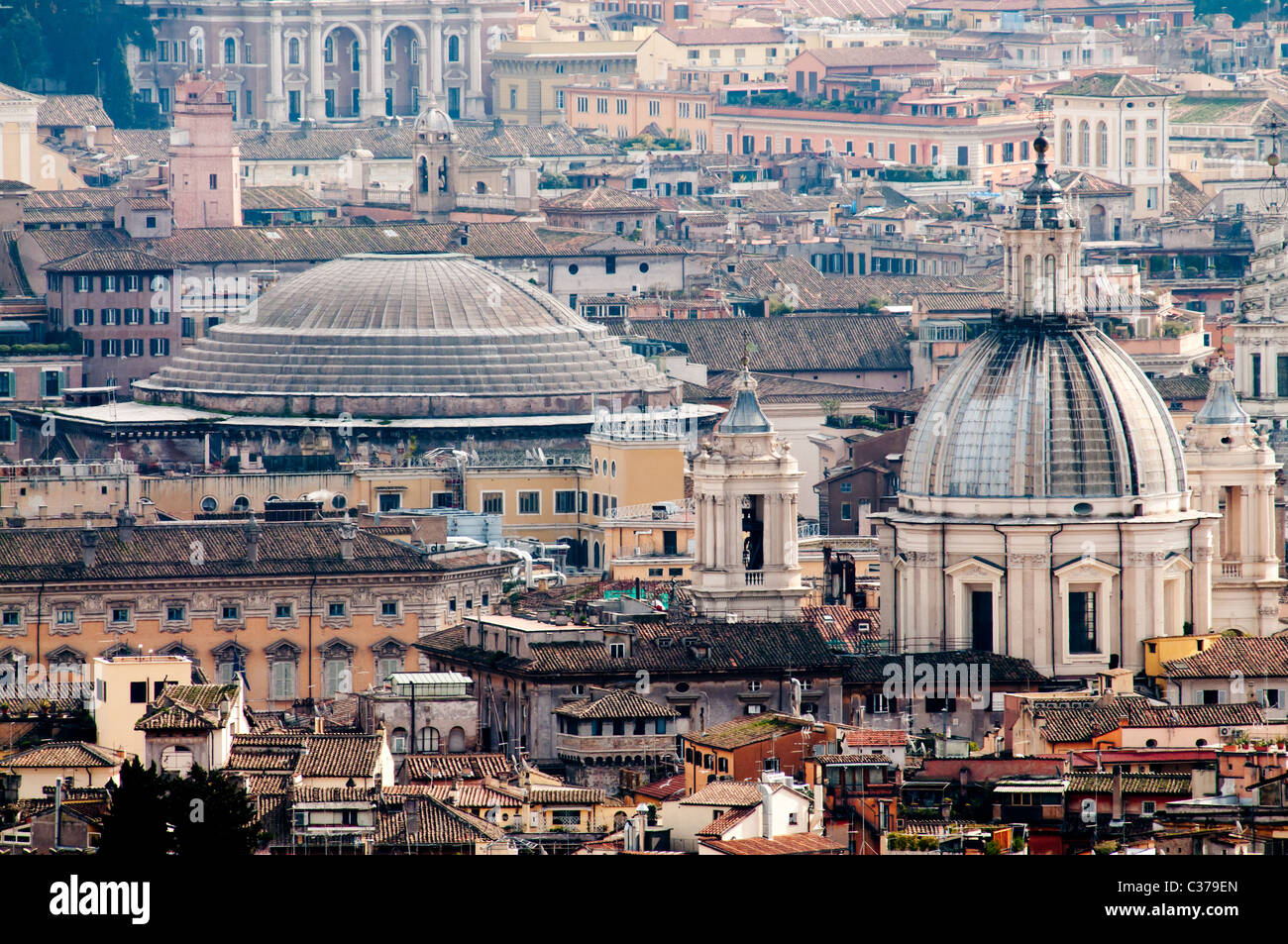 The roof of the Pantheon (left) and Sant'Agnese in Agone (right) towering over the Piazza Navona Stock Photo