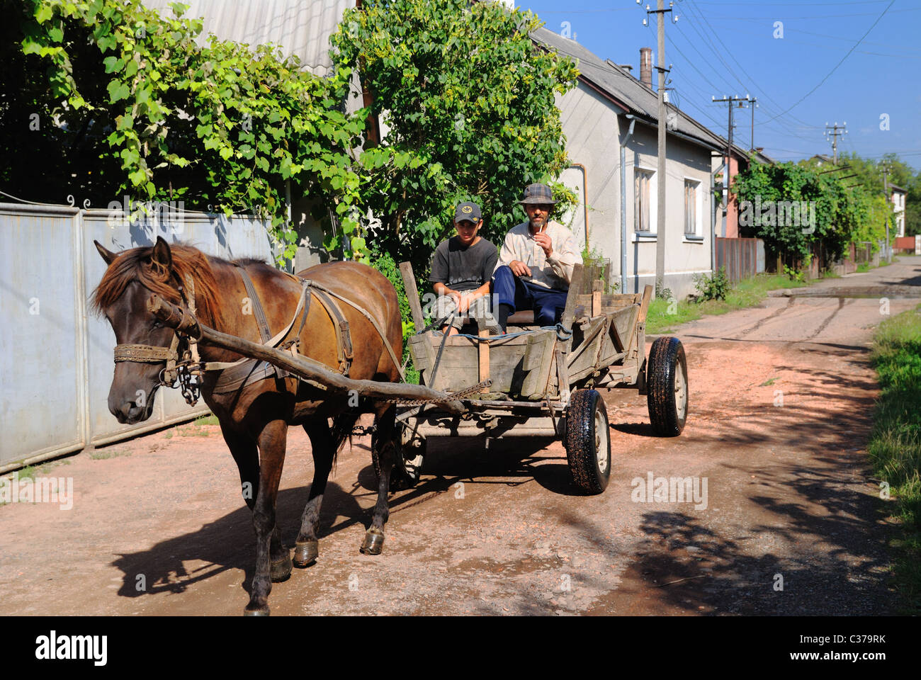 People riding on a horse cart, western Ukraine Stock Photo