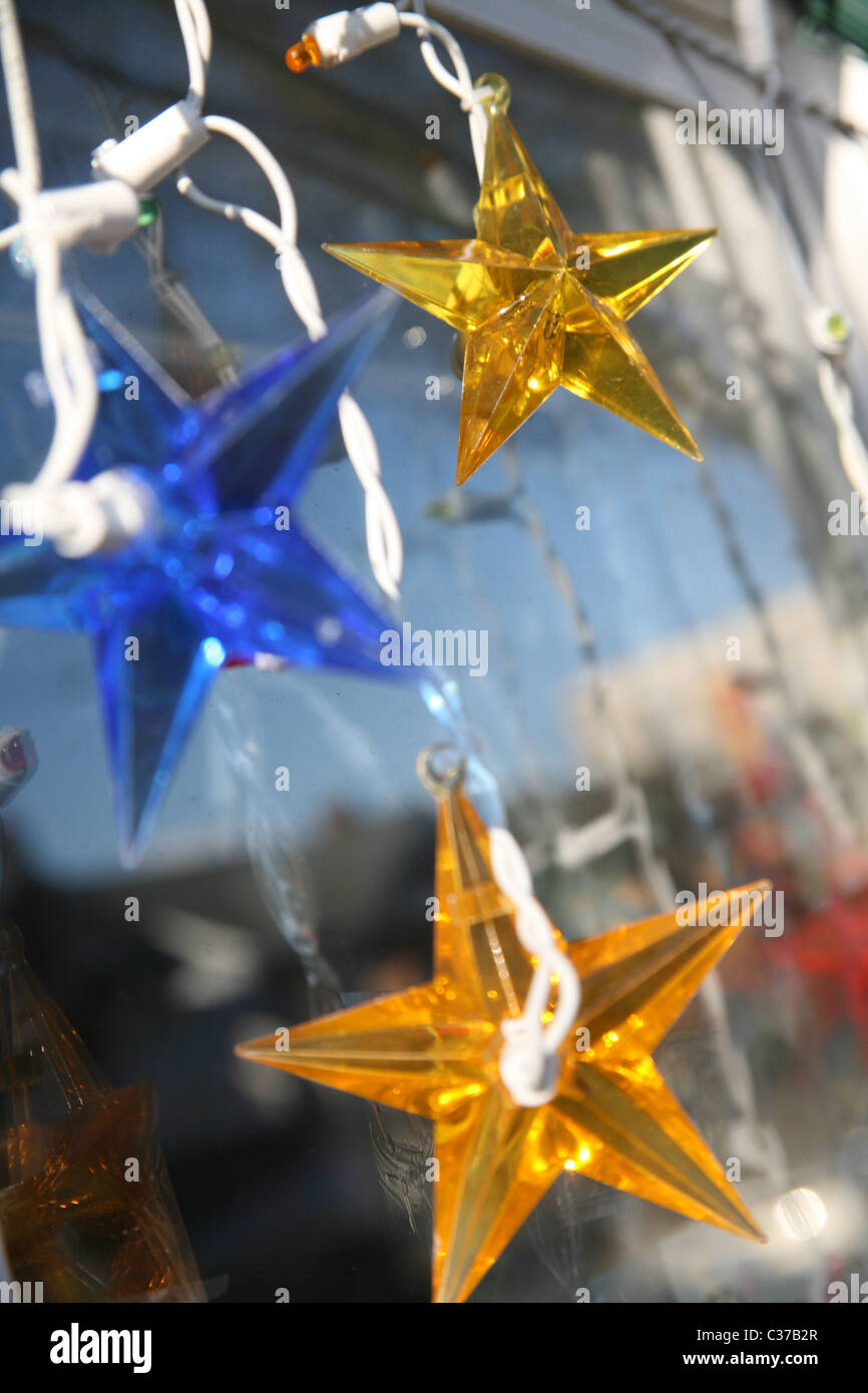 Star shaped lights hanging in window Stock Photo Alamy