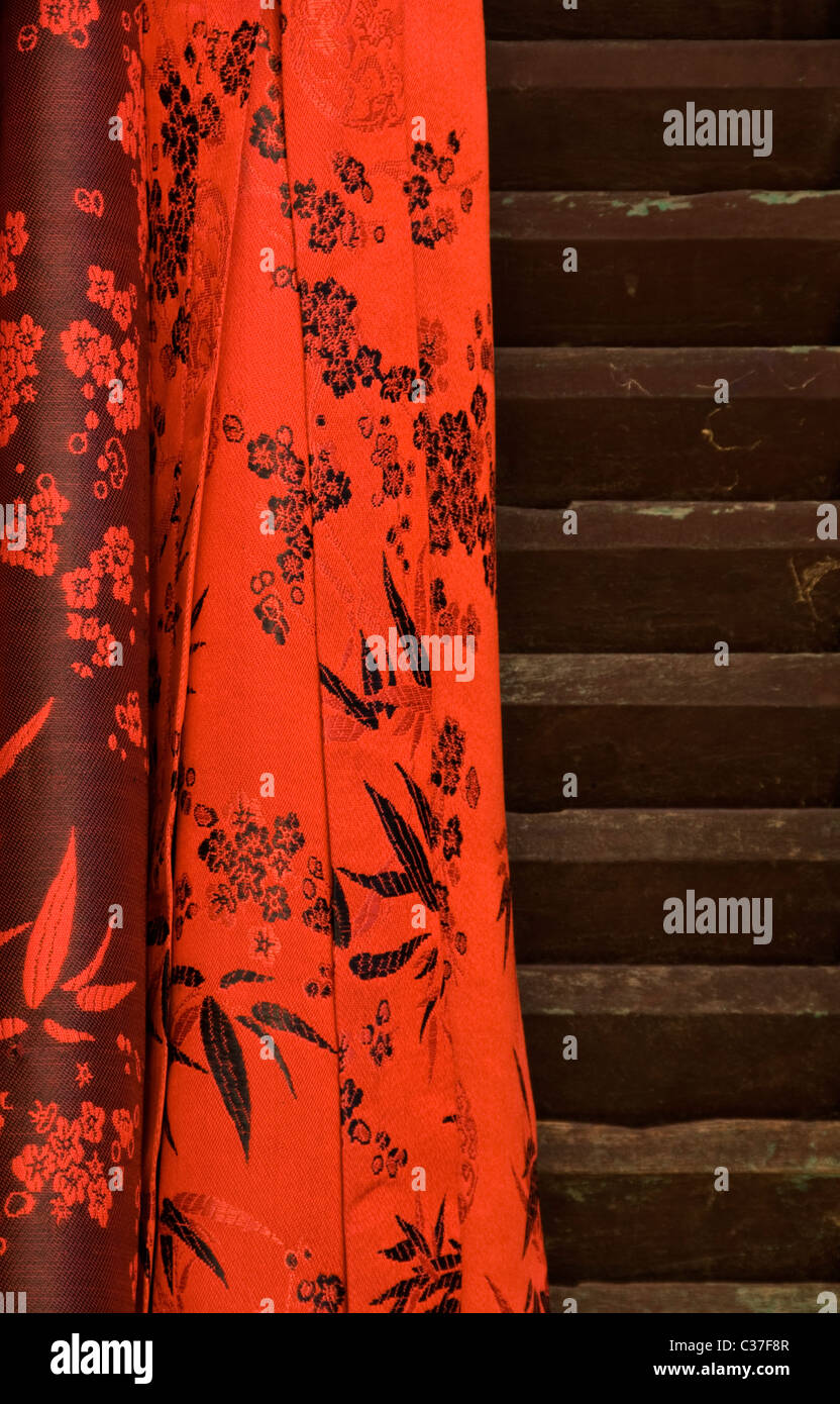 Silk fabric against wooden shutters, Hoi An, Viet Nam Stock Photo - Alamy